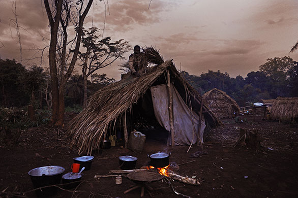 Obo Dispatch: Civilians constructing a hut in the displacement camp, Obo