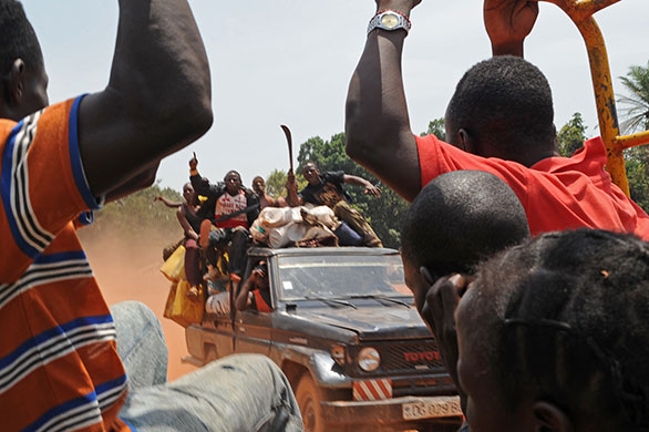 Obo Dispatch: A pick-up truck filled with militiamen patrols the road to Bangui