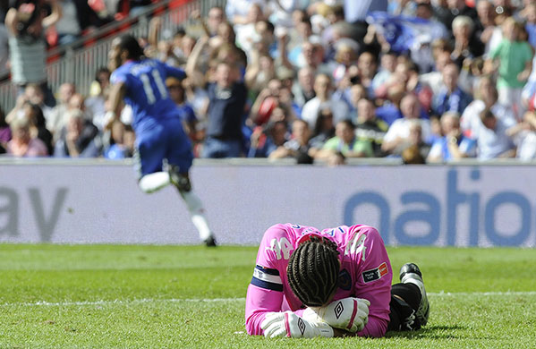 FA Cup Final: James buries his face as Drogba celebrates his strike 