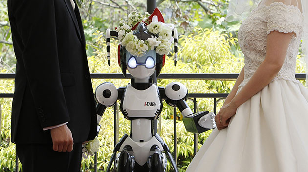 24 hours in pictures: robot called I-Fairy acts as a witness at a wedding in Japan