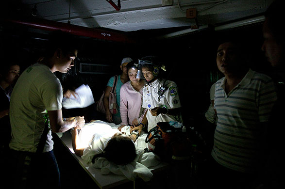 Thailand protests: Medical staff help patient at the Dusit Thani hotel Thailand