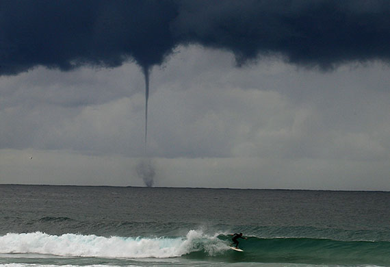 24 hours in pictures: A water spout or  tornado  in Australia