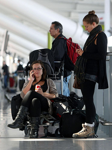 Volcanic ash: Passengers wait at Heathrow Airport after volcanic ash caused delays