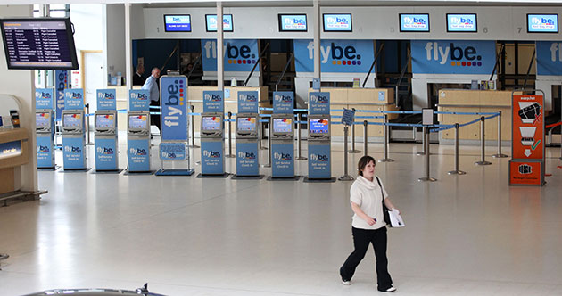 Volcanic ash: A woman walk in a deserted Belfast City Airport, Northern Ireland