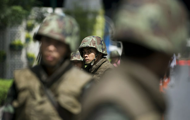 Thai clashes: Thai soldiers stand in a roadblock