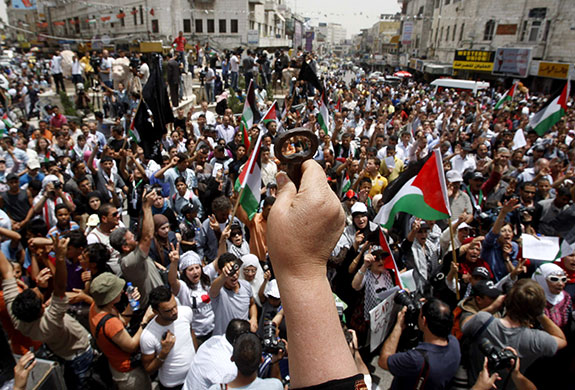 24 hours in pictures: A Palestinian at a rally marking the anniversary of the  Nakba