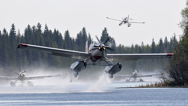 24 hours in pictures: Fire fighting planes prepare to help fight a 3000 hectare wildfire 