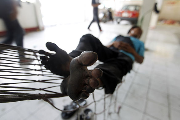 24 hours in pictures: An anti-government protester sleeps in Bangkok