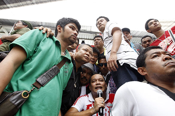 Bangkok protests: Bodyguards surround anti government protest leader Natthawut Saikua