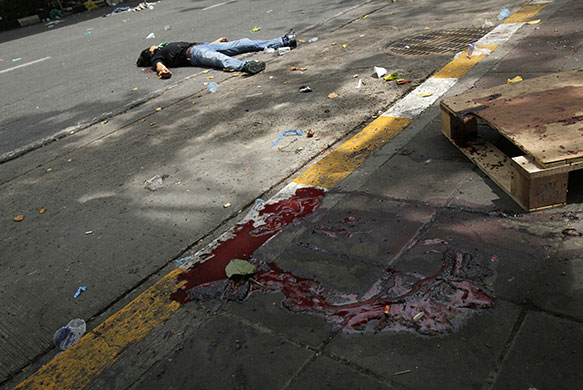 Bangkok crackdown: The body of an anti-government protester