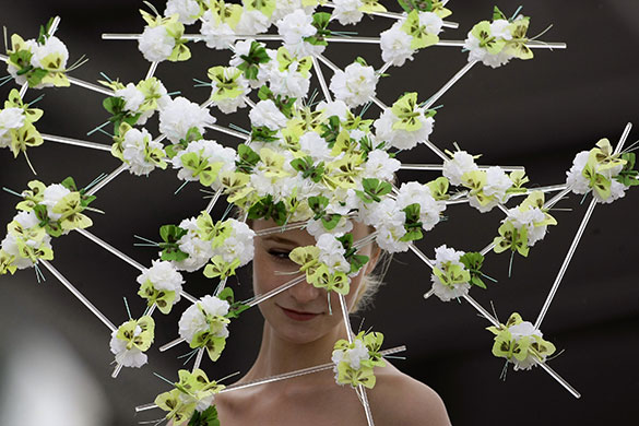 Epsom fashion: A woman wears a hat during Ladies day at the Epsom Derby Festival 