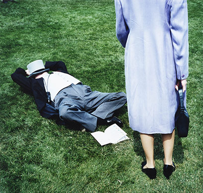 Epsom fashion: A man snoozes on the grass at the Epsom Derby