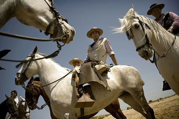 24 hours in pictures: Sanlucar de Barrameda, Spain: Pilgrims ride horses
