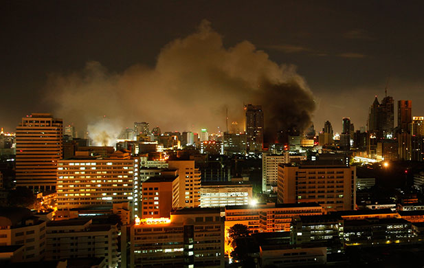 red shirt protesters: Smoke rises from burning fires in downtown Bangkok