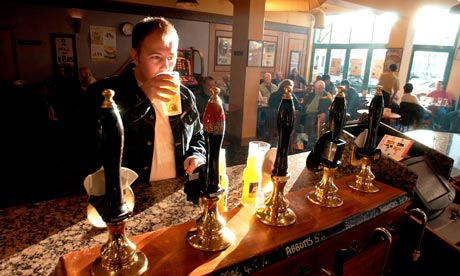 A man sinking a quiet pint