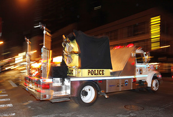 New York car bomb: An NYPD truck with a bomb protective vault on the back rushes past