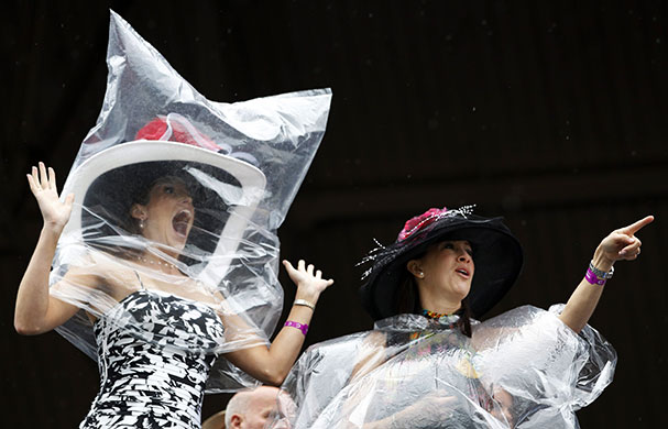 24 hours in pictures: Louisville, US: Race fans brave the rain at the 136th Kentucky Derby