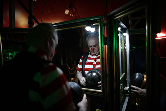 24 hours in pictures: Sofia, Bulgaria: A clown prepares backstage