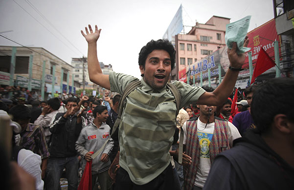 24 hours in pictures: Katmandu, Nepal: Supporters of the Communist Party of Nepal shout slogans