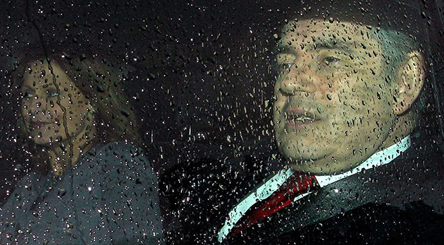Election campaign: Gordon Brown with his wife Sarah in a rain soaked car  in London