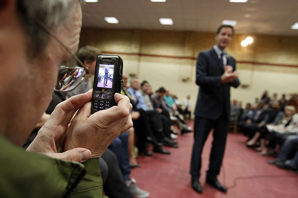 Election campaign: Nick Clegg is photographed on a mobile phone