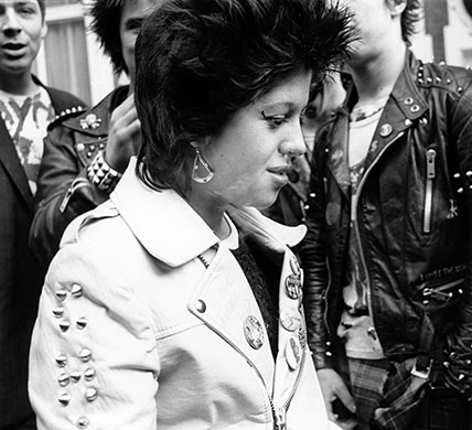 PYMCA: 1979: A punk girl wearing a leather jacket with studs and badges, London