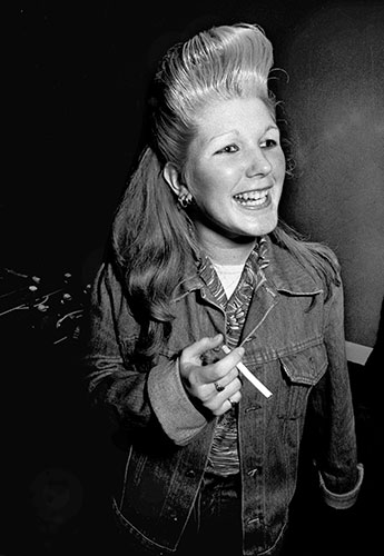 PYMCA: 1980: A Rocker girl with a large quiff, at a gig in Southgate, London
