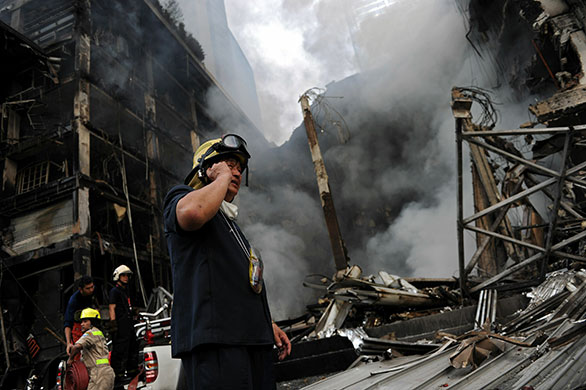 Thailand: A fireman talks on his mobile phone at Thailand's biggest shopping mall