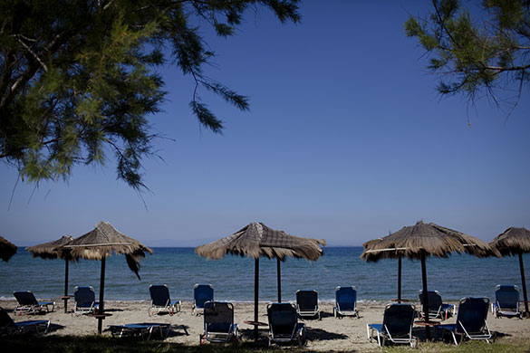 Week in business: unloungers remain empty on a beach on the island of Lesbos, Greece
