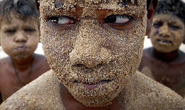 24 hours in pictures: Indian children enjoy playing at the Juhu beach in Mumbai