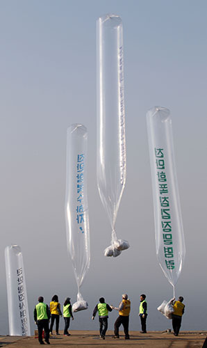 24 hours in pictures: Baengnyeong Island South Korea activists release balloons carrying leaflets