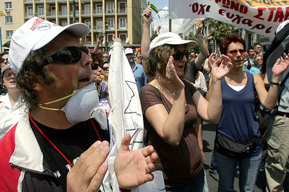 24 Hour Protest: Demonstrators shout slogans in 24 hour protest in Athens, Greece 