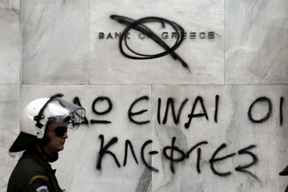 24 Hour Protest: Graffiti on the Bank of Greece in 24 hour protest in Athens, Greece 