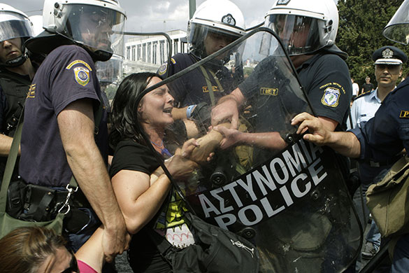 24 Hour Protest: Riot police officers move protester in 24 hour protest in Athens, Greece 