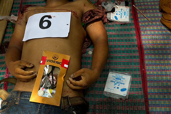 24 hours in pictures: Bangkok, Thailand: The body of a protester