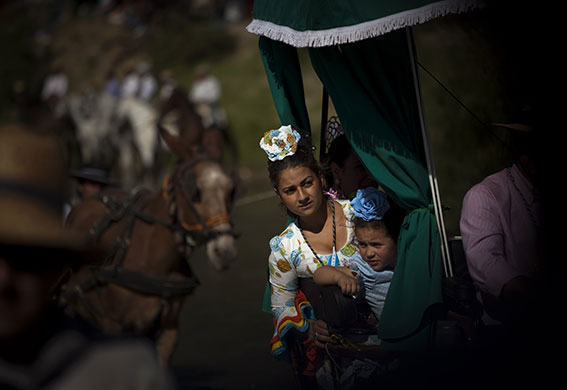 24 hours in pictures: Villamanrique, Spain: Pilgrims travel on their horse carts