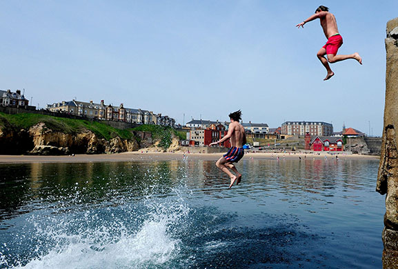 Sunny weather: People enjoy the hot weather at Cullercoats in North Tyneside