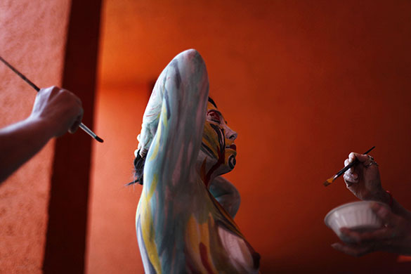 24 Hours in Pics: A model is painted at the Fonambules Body Paint Festival in Mexico City