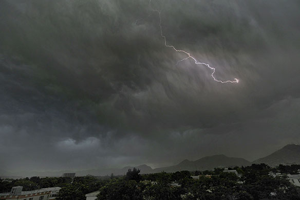 24 Hours in Pics: Rain clouds approach on nightfall in Kabul