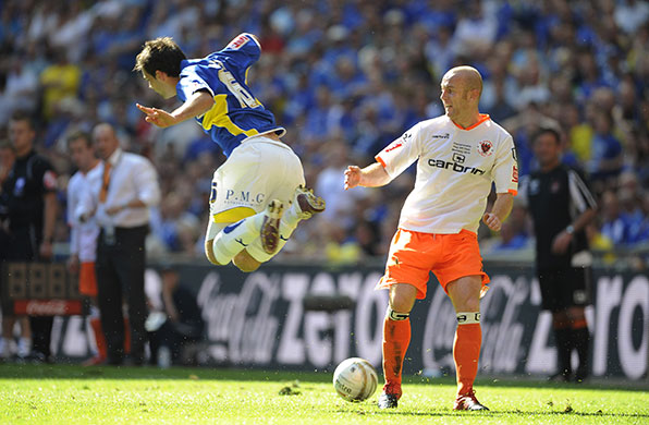 Play Off Final: Crainey tackles a flying Ledley