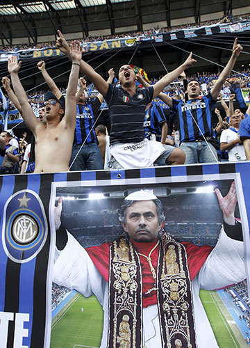 Champions League Final: Inter Milan fans with a poster of Mourinho dressed as the Pope