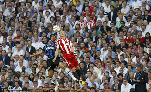 Champions League Final: Cristian Chivu, left, and Arjen Robben as they do battle in the air
