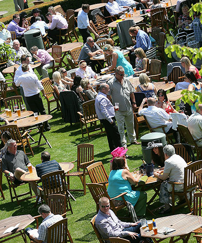 weather: Spectators enjoy  the warm weather at Goodwood racecourse in Chichester