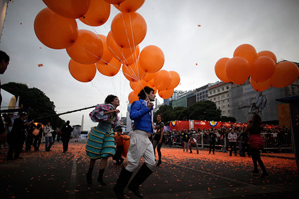 24hours: Buenos Aires, Argentina People perform with balloons during a parade