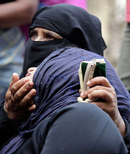 Air India crash 2: Veiled Muslim women mourn after the identification of dead bodies