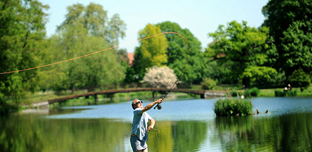weather 2: A fisherman casts his line at Syon Park Fishery