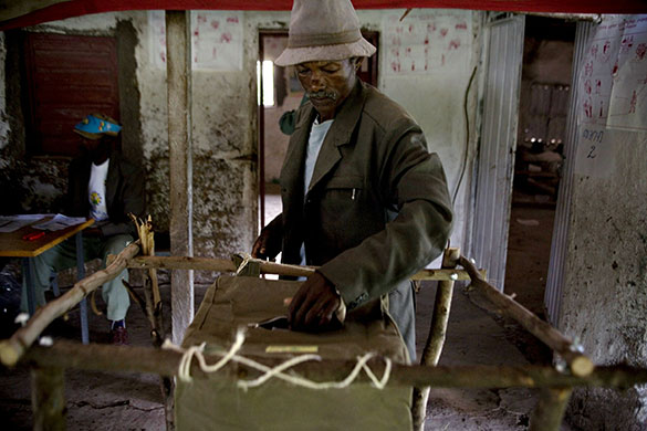 Ethiopia elections: A voter casts his vote at a polling station in the village of Debre Zeyt