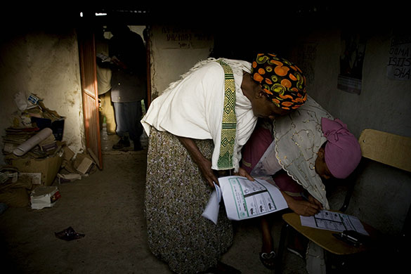 Ethiopia elections: Women mark their votes at a polling station in the village of Debre Zeyt