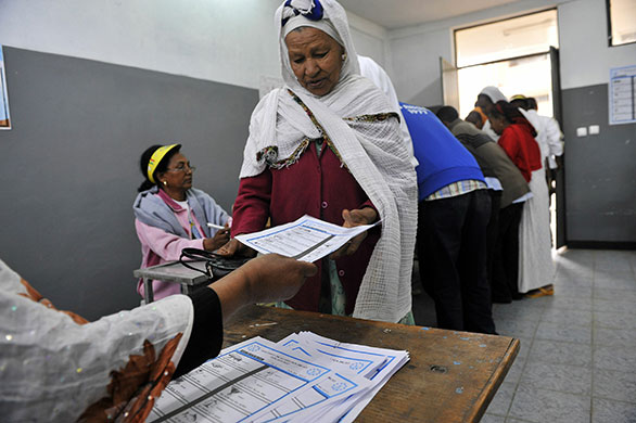 Ethiopia elections: An Ethiopian woman gets ballot papers at a polling station in Addis Ababa
