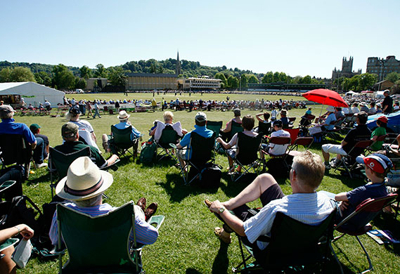 weather: Cricket fans soak up the very hot weather during a match in Bath